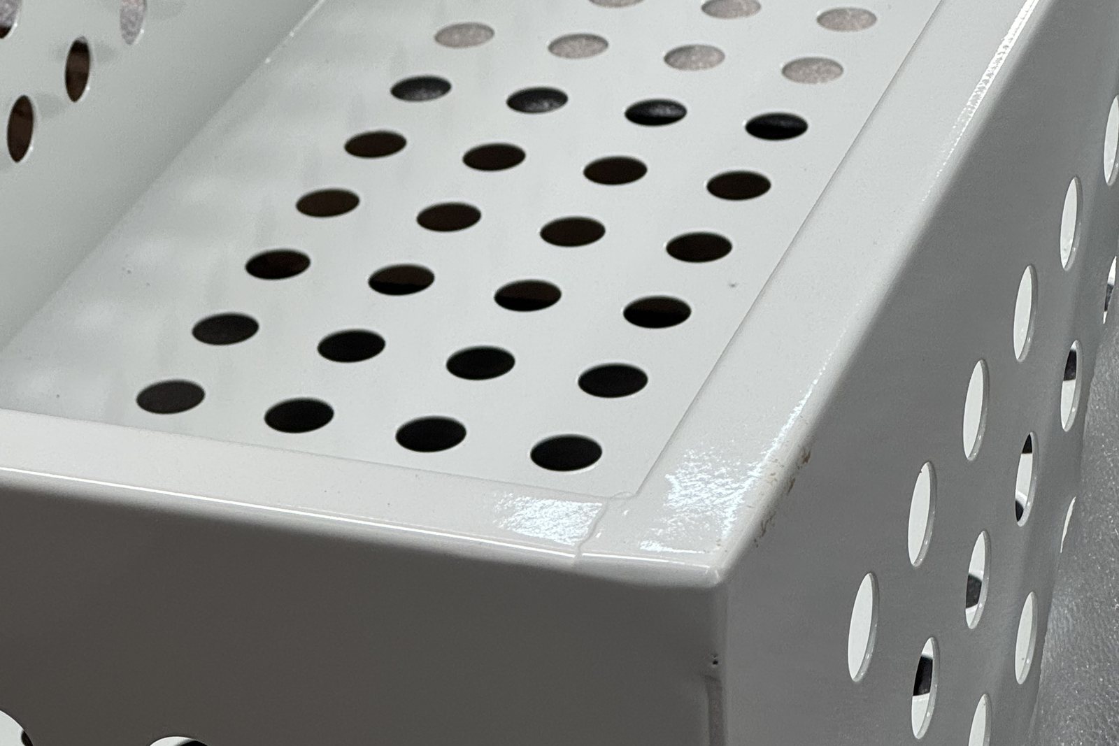 White powder coated perforated sheet metal enclosure