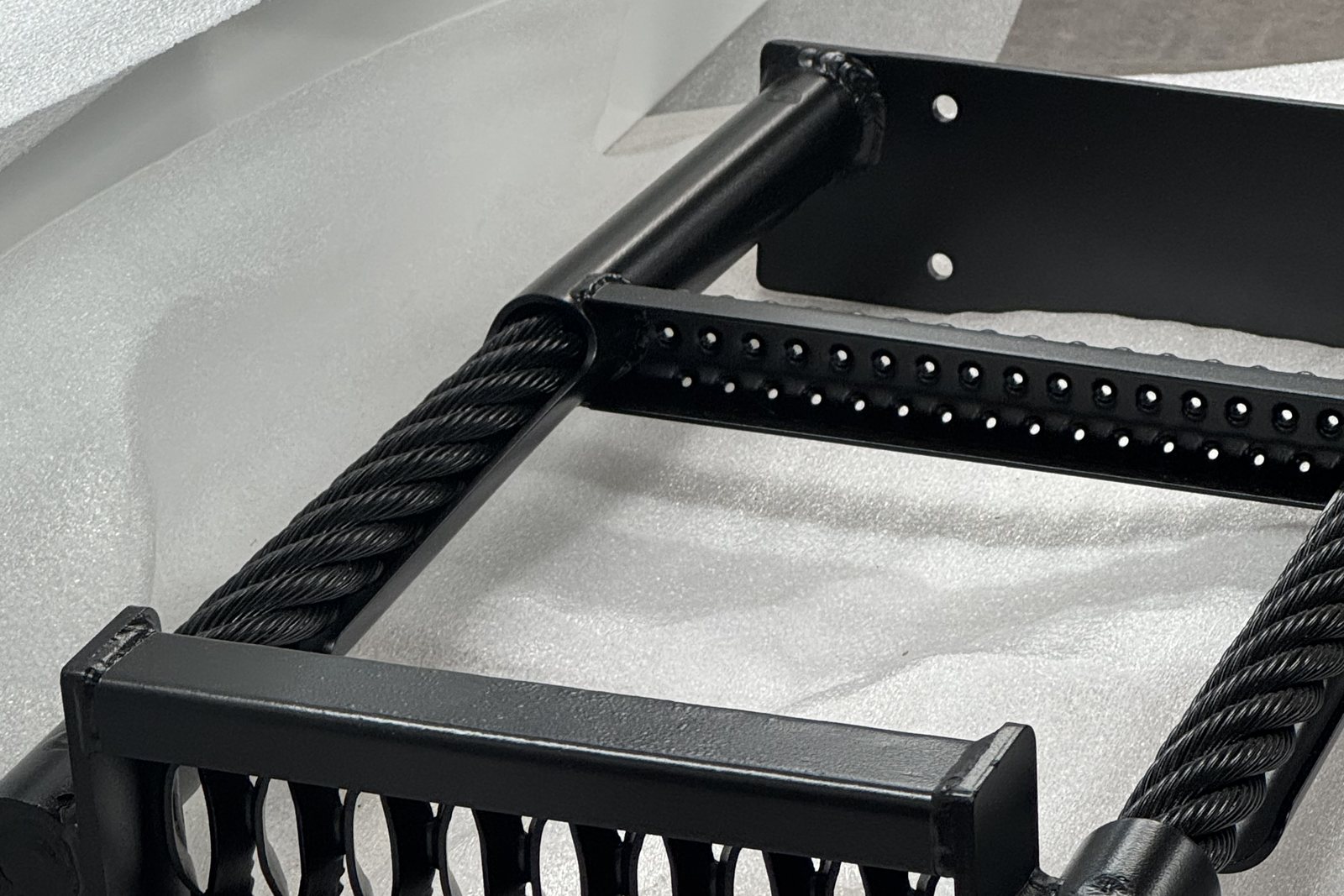 Black powder coated welded steel assembly